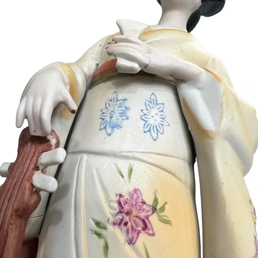 Vintage geisha holding